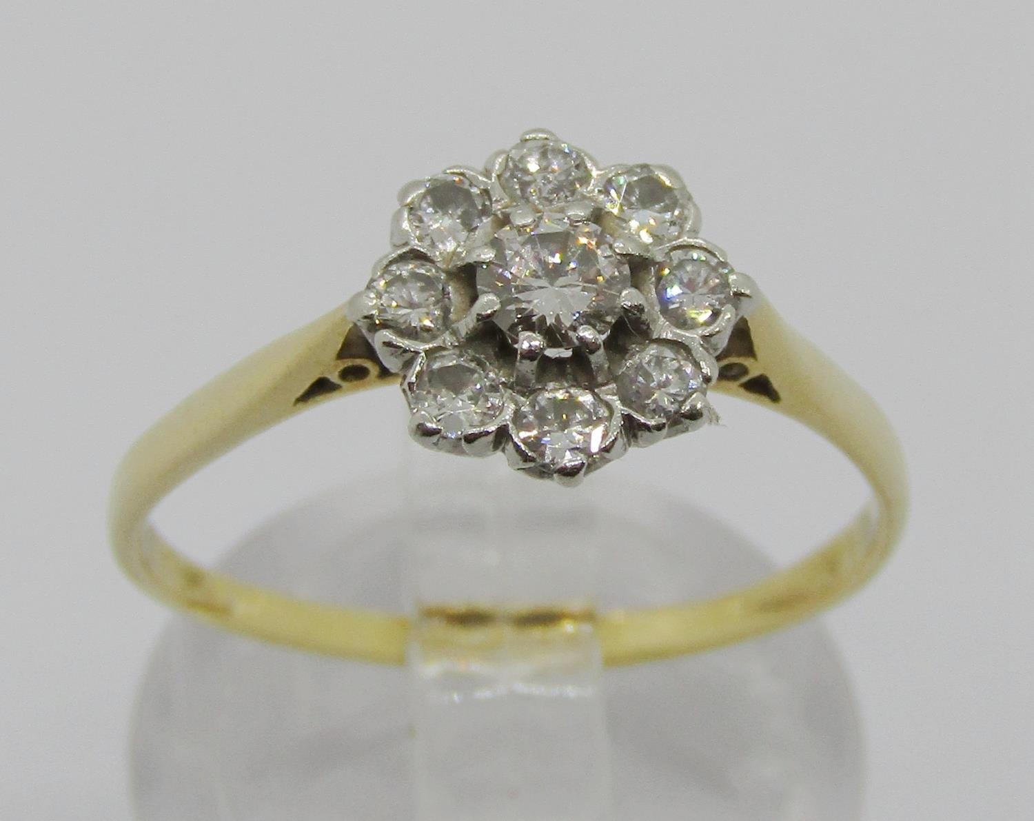 Yellow metal diamond cluster ring, centre stone 0.20ct approx, size P/Q, 2.1g