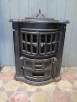 An Esse no2 cast iron bow fronted stove with pierced dome cap, (af for re-glazing) approx 50cm