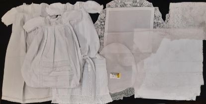 Four early 20th century baby gowns with lace, broderie anglaise and pin tuck detail, together with a