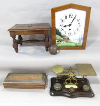 A wall clock with an enamel painted Alpine scene to the face and an antique pair of postal scales