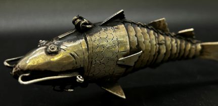 A silver metal articulated fish 'pike', pill box with a hinged head, 12 cm long approximately