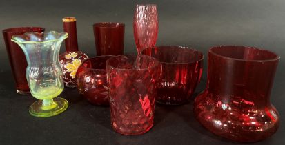 A collection of Victorian Cranberry glass to include condiments, glass beakers, glasses, small