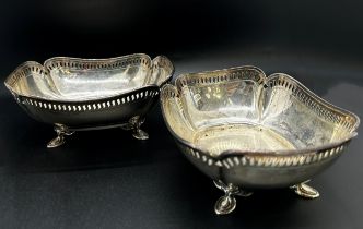 A pair of silver bon bon dishes with pierced sides raised on pad feet, Sheffield 1919 makers Atkin