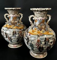 Pair of late 19th century Japanese vases showing characters in extensive landscape