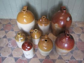 A small collection of stoneware flagons and jars to include salt glazed examples, four and two