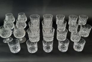 A selection of clear cut glass whiskey tumblers of various shapes and sizes and six brandy bowls