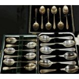 Three boxed sets of six silver teaspoons and a single small silver sugar tong, 7.3 ozs approximately