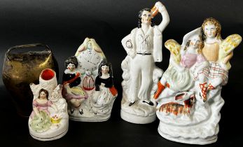 Collection of four Staffordshire flatback figures, together with a brass Swiss cow bell