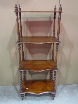 A Victorian mahogany whatnot on four tiers with turned supports