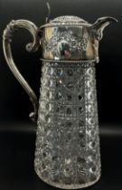 A diamond cut glass claret jug with silver mounts and handle engraved with garlands, London 1896,