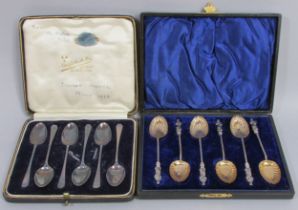 A cased sex of 6 silver teaspoons, a cased set of 6 apostle spoons, 7 napkin rings, sugar nips and a