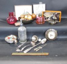 A miscellaneous collection of items including some wooden fruit, a W. Everett Cromer Soda Siphon,