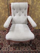 A Victorian mahogany drawing room chair with turned spindle mouldings