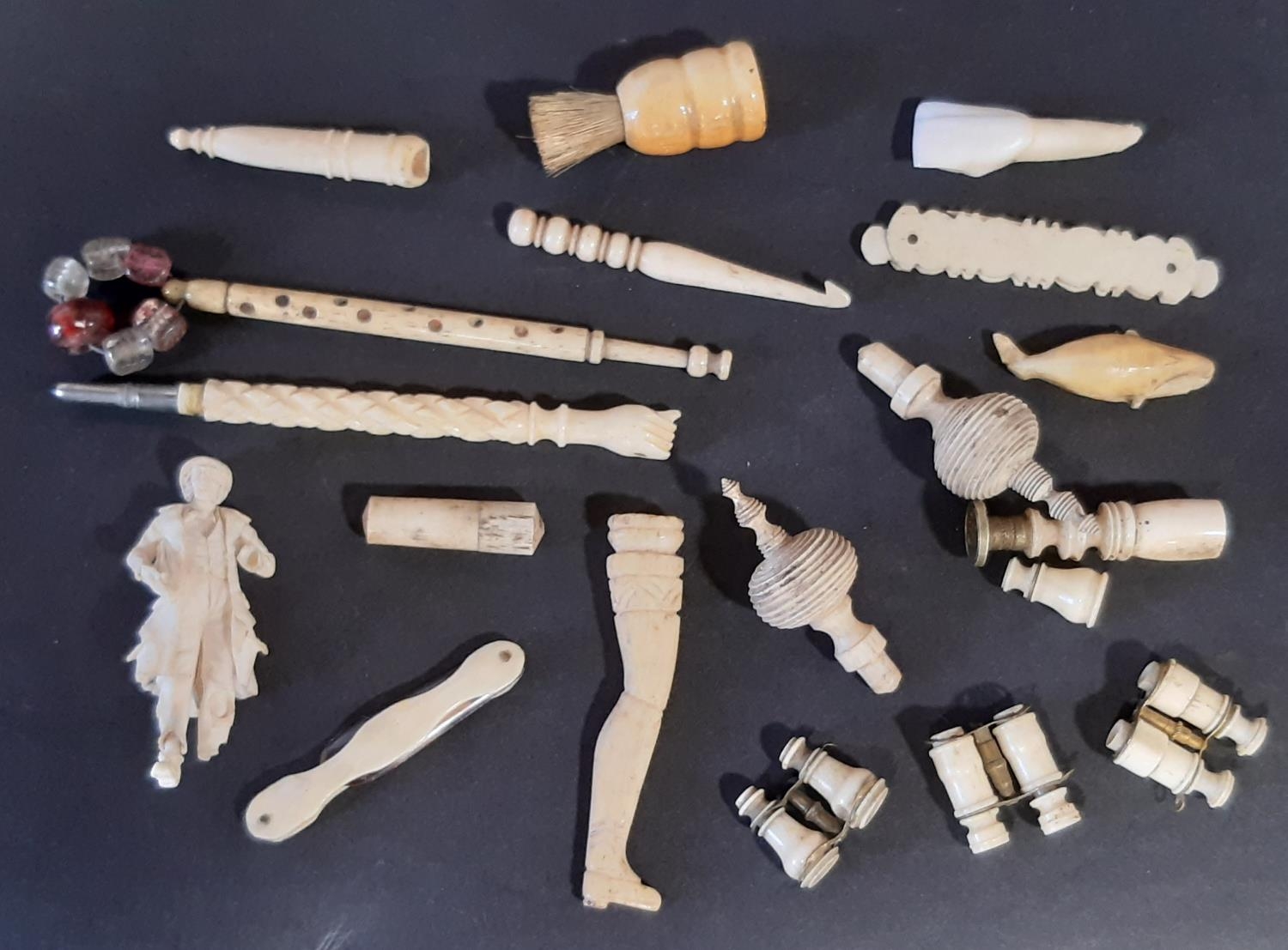 A collection of small turned bone objects to include Stanhopes, binoculars, whistle, etc