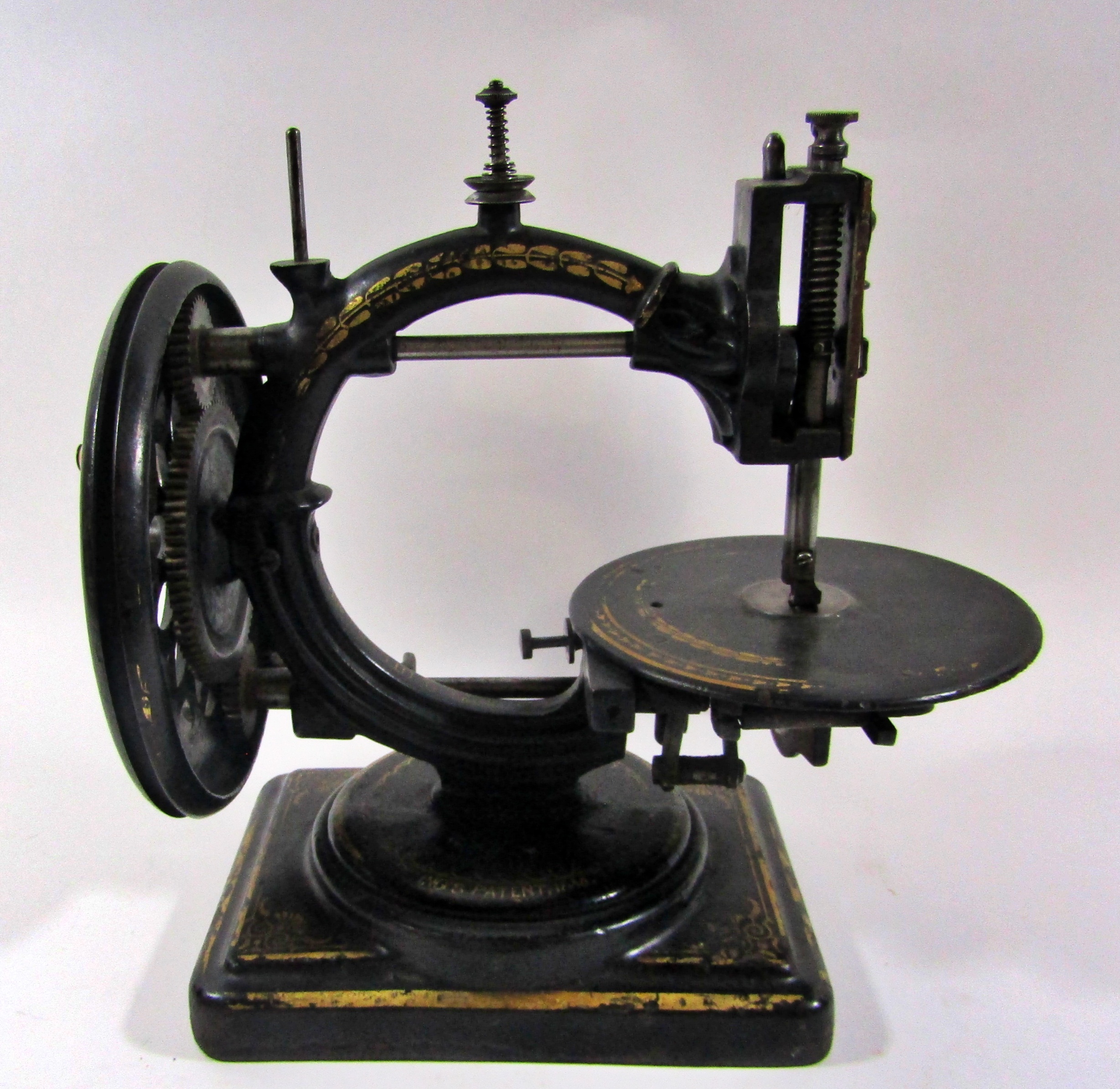 A scarce Nussey & Pilling 'Little Stranger' Victorian sewing machine with gilt decoration, on metal - Image 4 of 13