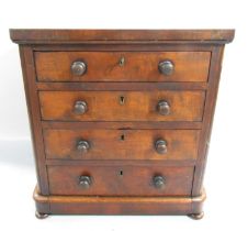 A Victorian mahogany miniature chest with four graduated drawers, raised on bun feet 35.5cm x 33cm