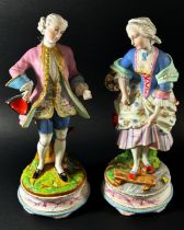 A pair of 19th century German bisque figures of male and female characters in 18th century dress,