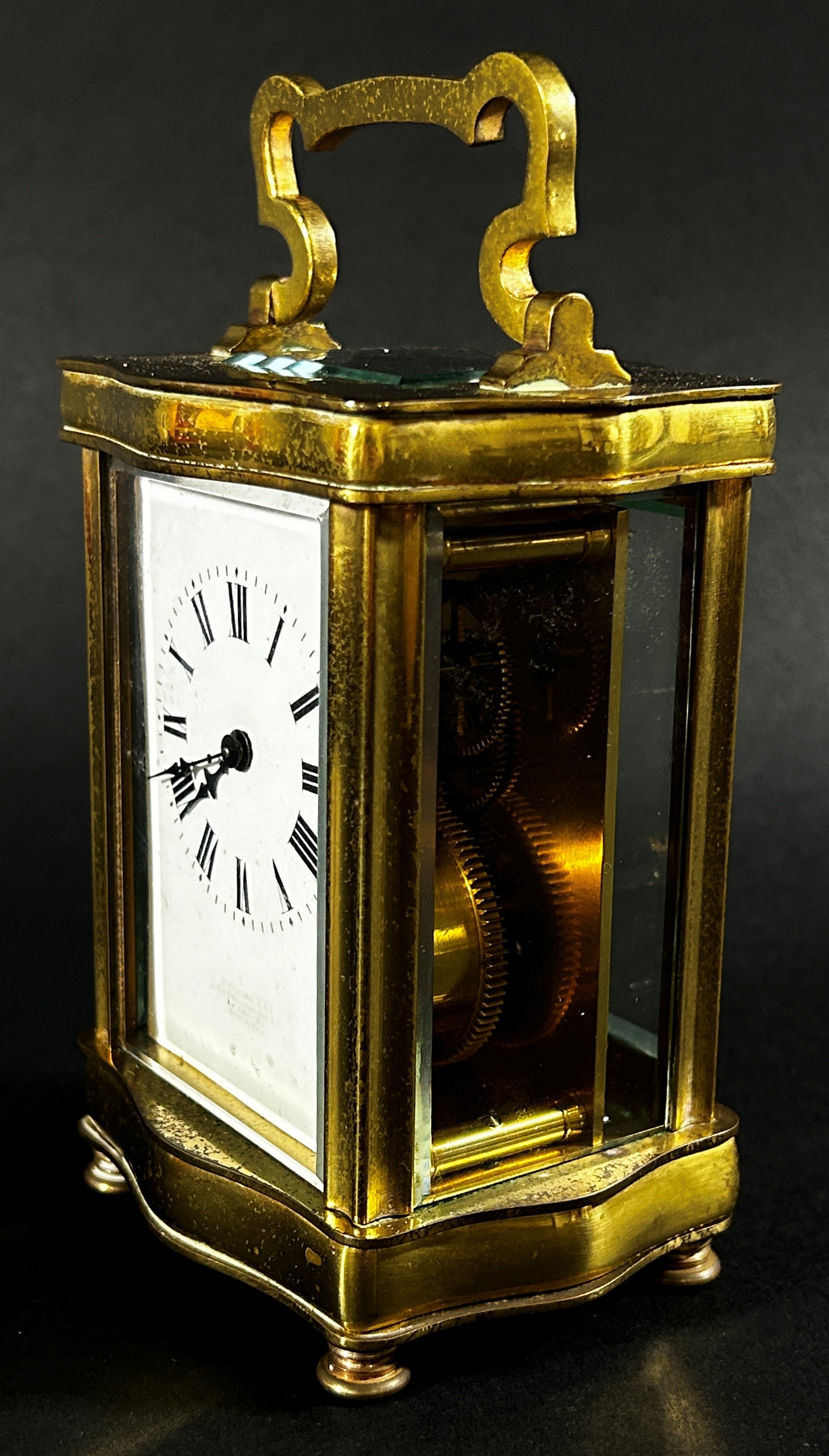 A brass carriage clock set within a shaped case with enamelled dial and eight day timepiece, - Image 2 of 5