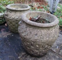 Pair of cast composition stone urn shaped planters with fixed handles and repeating pattern, 40cm