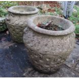 Pair of cast composition stone urn shaped planters with fixed handles and repeating pattern, 40cm