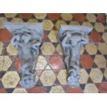 A pair of cast composition stone corbels with mermaid and merman detail, 52 cm high x 31 cm wide