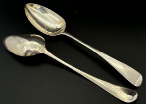 Three silver serving spoons and two dessert spoons, hallmarked T & Q respectively, Sheffield 1911,