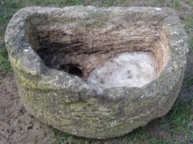 A weathered Natural stone D shaped trough with circular drainage hole, 27cm high x 68cm x 48cm