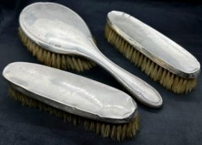 A group of silver Birmingham vanity pieces, including hairbrushes, mirror and a 20th Century