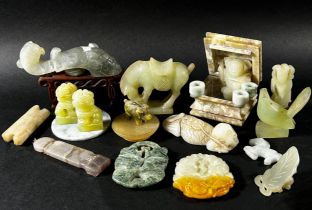 A mixed collection of Chinese bowenite / jadeite jade items to include a pale grey belt hook, Bi