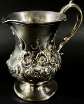 A heavily engraved Victorian silver milk jug, London 1872, makers Daniel & Charles Houle, 10cm high,