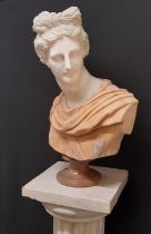 Bust of Apollo in two marbles, principally Carrara, raised on a Carrara oval fluted column,