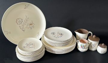 A 1950s Freeform Poole pottery open bowl with repeating leaf detail, further oval meat plate with