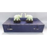 A pair of Chinese carved hard stone / bowenite jade elephants, one with restored break to trunk in