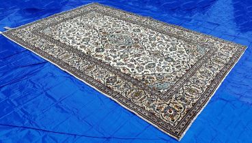 Central Persian Kashan Carpet with an all over floral pattern around a central floral spandrel on