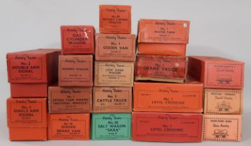 18 boxed 0 gauge Hornby railway models comprising wagons, trucks, vans, track accessories and