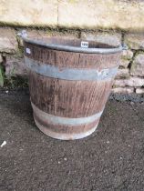 A vintage coopered and galvanised steel banded bucket with loose loop handle, 33cm diameter x 31cm