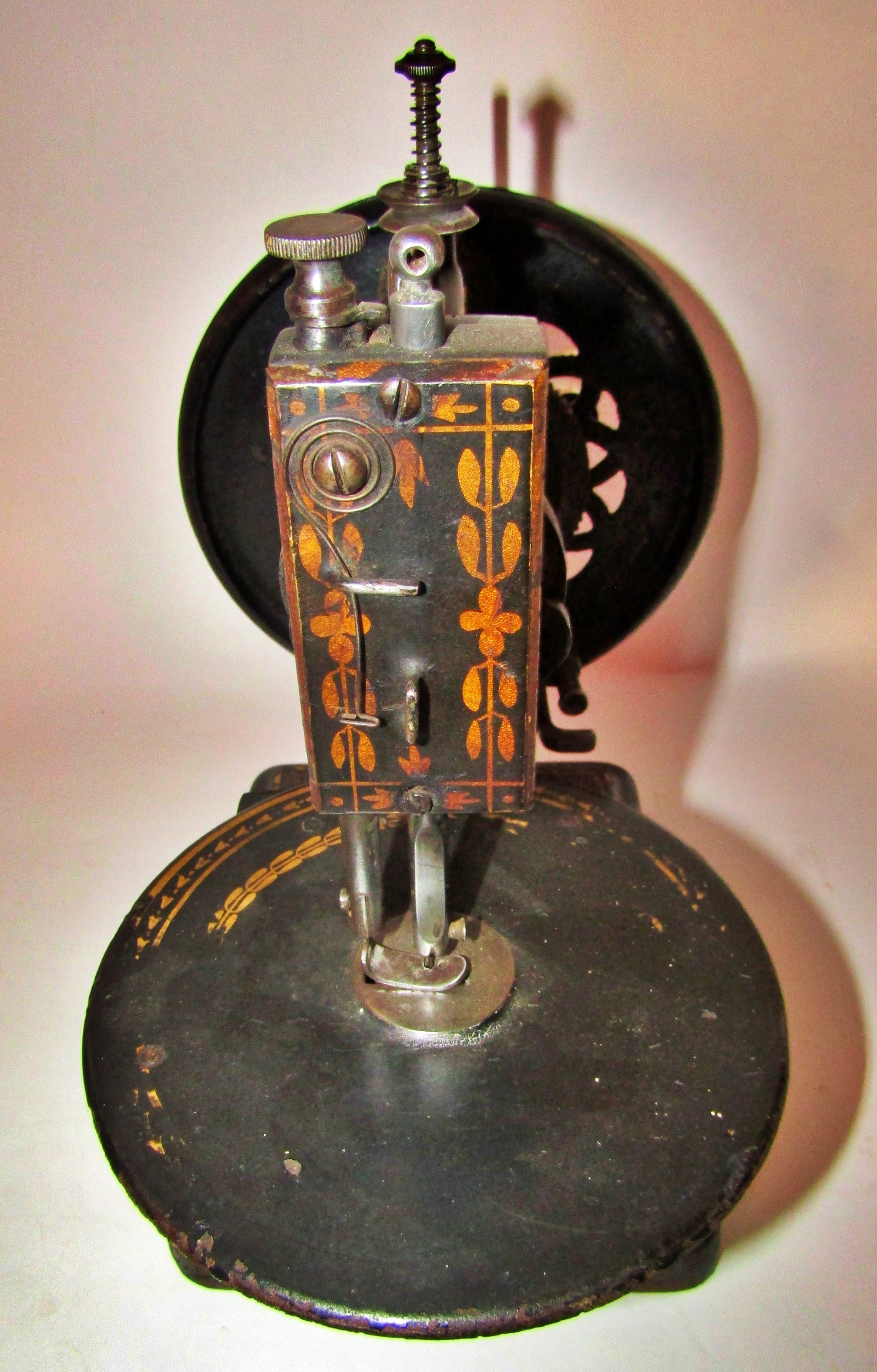 A scarce Nussey & Pilling 'Little Stranger' Victorian sewing machine with gilt decoration, on metal - Image 10 of 13