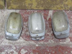 Three vintage bulk head industrial light fittings