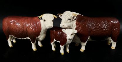 A Beswick group of a Hereford bull, cow and calf (3)