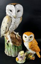 An Italian pottery of a barn owl upon a stump (life sized) together with a Beswick owl and figure of