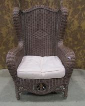 A Victorian style wicker conservatory/veranda chair, winged framework enclosing decorative panels