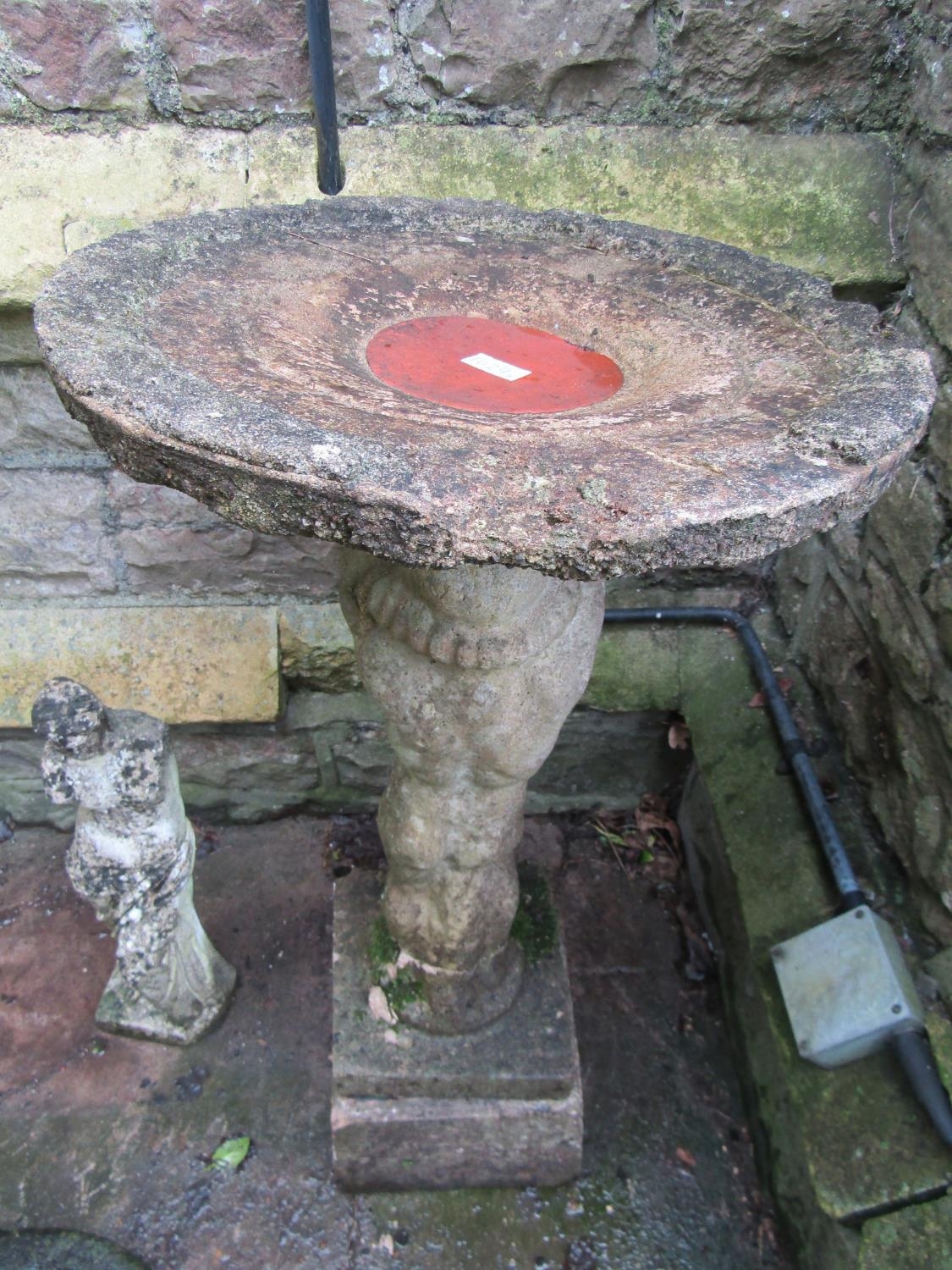 A weathered cast composition stone bird bath with standing cherub base supporting a shallow bowl ( - Image 2 of 6