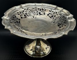 A silver table centre piece tazza with pierced filigree work to the bowl, Sheffield 1919, maker