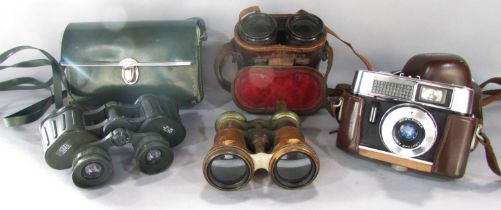 A Voigtlander vintage camera, a pair of military binoculars, a pair of green rubberised water