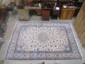 Persian style wool and silk carpet with white field, multi floral details set within alternate