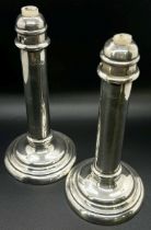 A pair of students silver sprung candlesticks, Birmingham 1903, makers mark rubbed, together with