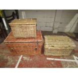 A large wicker laundry basket with side carrying handles, 54cm high x 90cm x 55cm, together with two