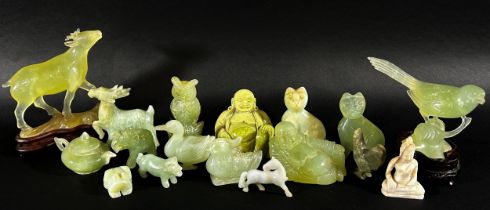 A collection of Chinese carved bowenite jade, pink quartz and other hardstone animals, to include