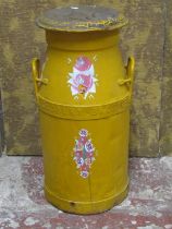An over-painted (yellow) milk churn, a vintage swing letter/numerical display and a small shield