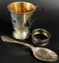 A silver Christening cup, a presentation spoon and a napkin ring, 3.7 oz (3)